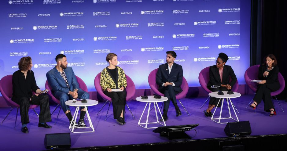 Virginie Chauvin on stage during a Women's Forum conference with five other personalities