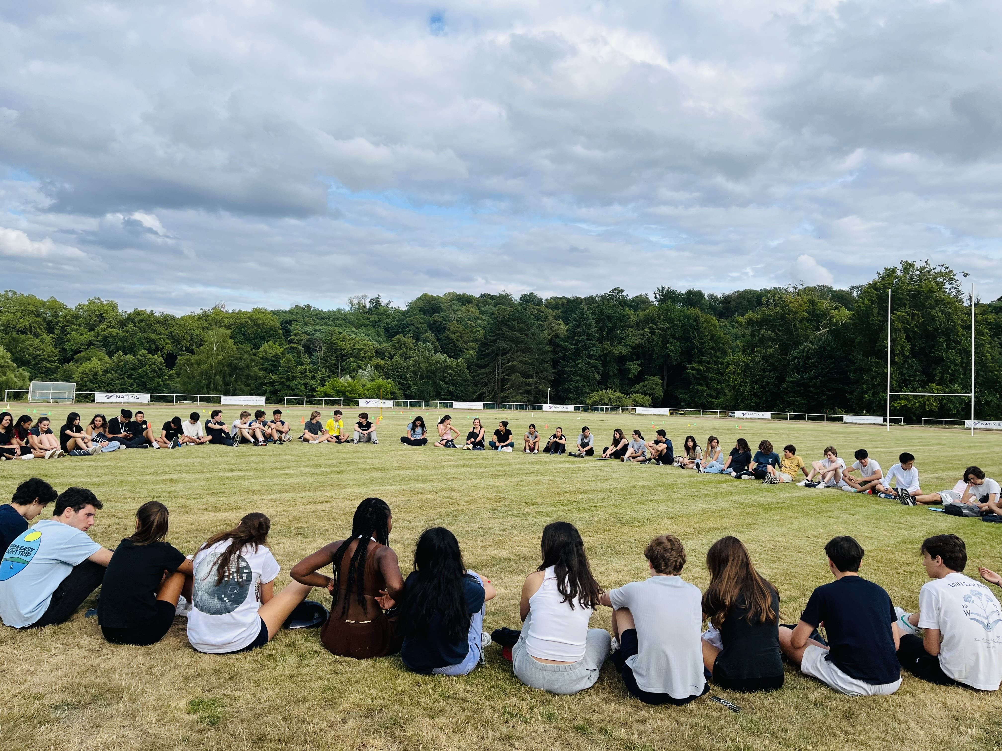 Students outside in a circle